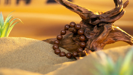 Sandalwood Zen Incense Bracelet lean against wood on the desert for Spiritual Grounding