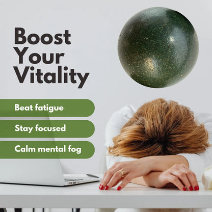 A person with red hair rests their head on a white desk next to an open laptop, while a dark green incense bead bracelet boosts vitality, beats fatigue and calms mental fog.