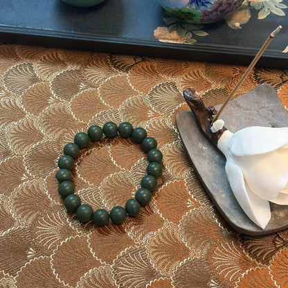 wearable aromatherapy bracelet made with plum and bamboo for calming and relaxation
